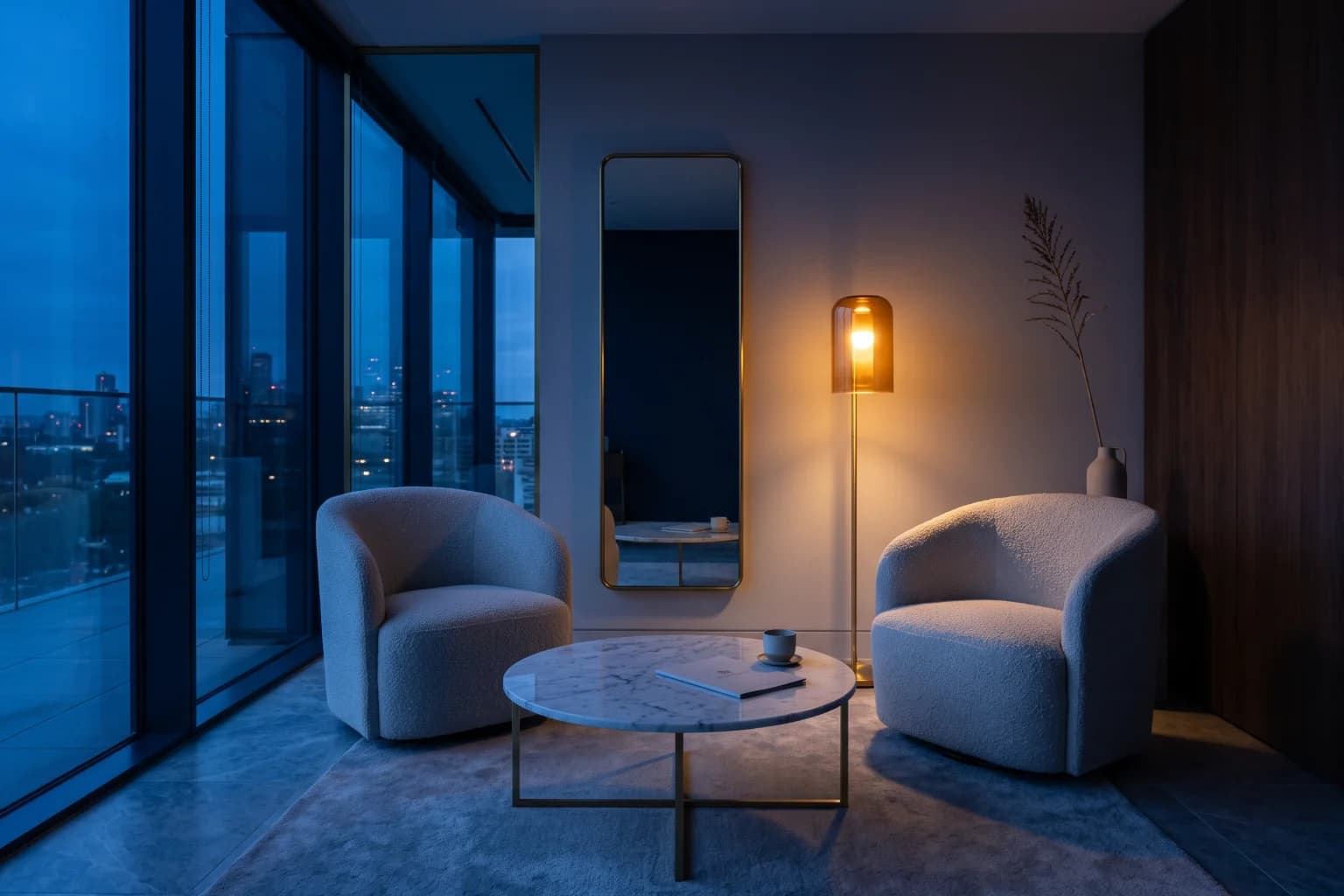 An aesthetic clinic consultation room at dusk, two chairs and one lit floor lamp.
